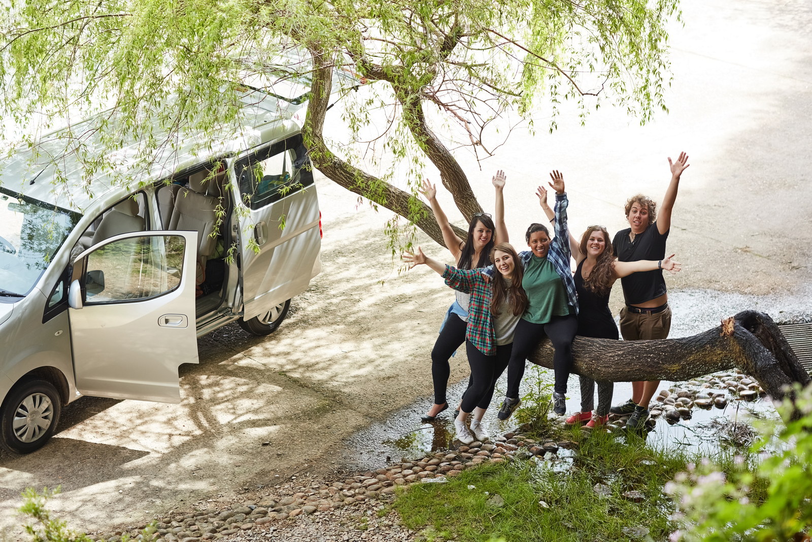 Portrait of a group of friends having fun together while out on a roadtrip.
